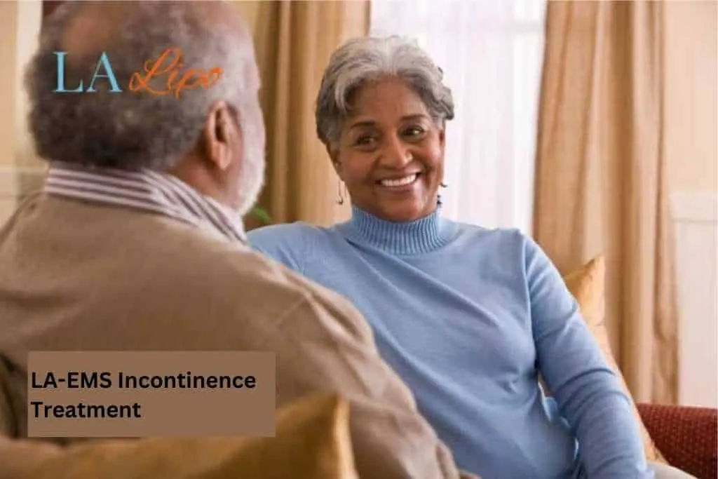 Couple sat smiling at each other - LA-EMS treatment Wilmslow